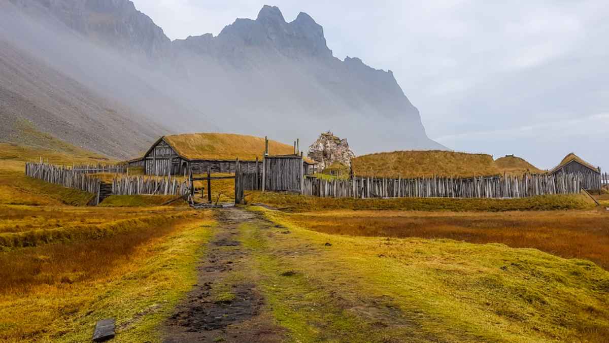 Remanents of a viking village in east Iceland Viking village in Iceland with rugged mountains and moss