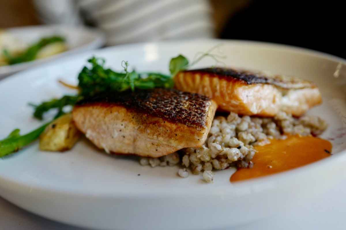 Pieces of traditional scandinavian salmon Traditional Icelandic dinner consisting in grilled fish and vegetables