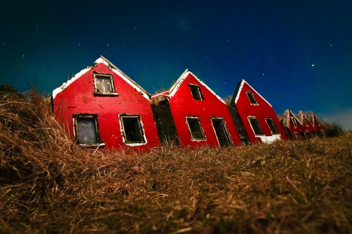 A delightful elf house nestled in the greenery of Iceland, capturing the magical and whimsical essence of Icelandic folklore.