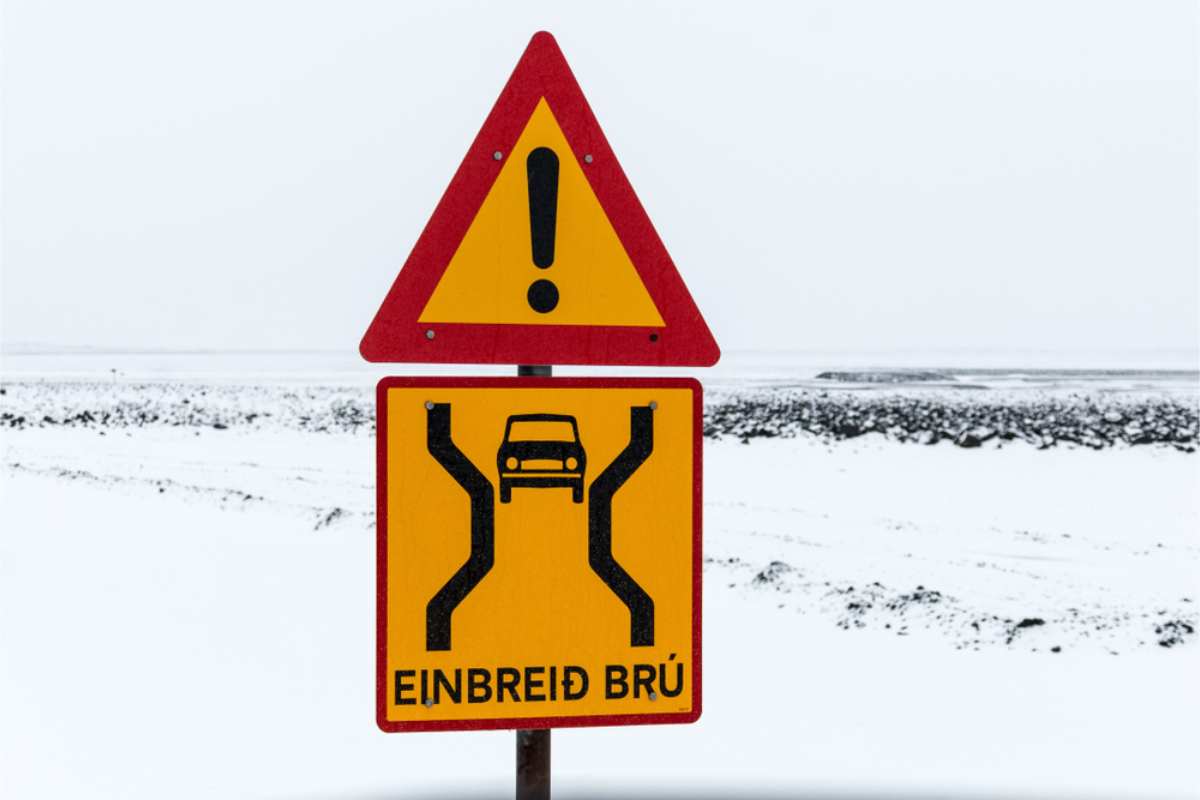 Single lane bridge yellow sign in Iceland