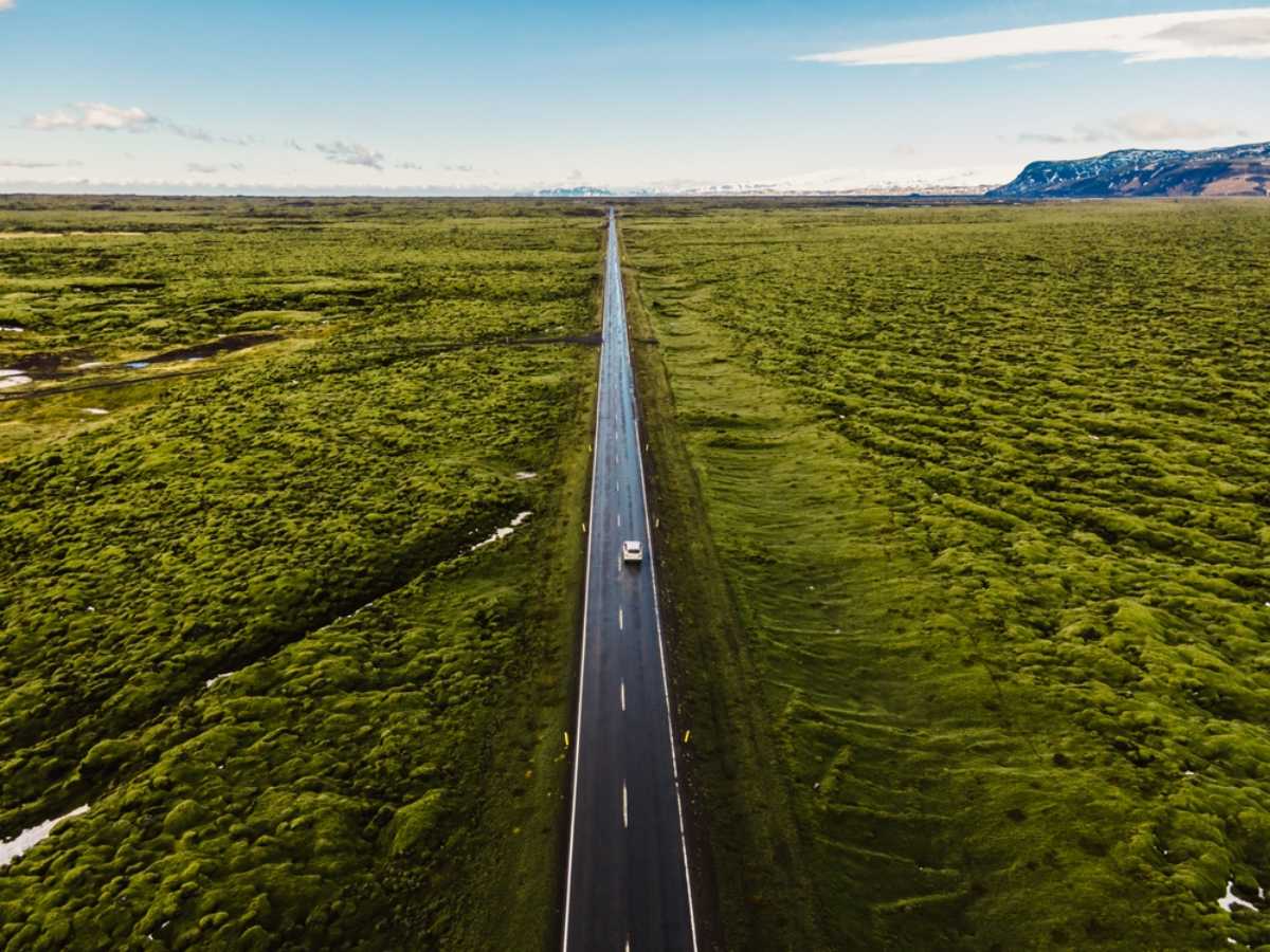Drone view of a straight section of the Ring Road on a sunny day