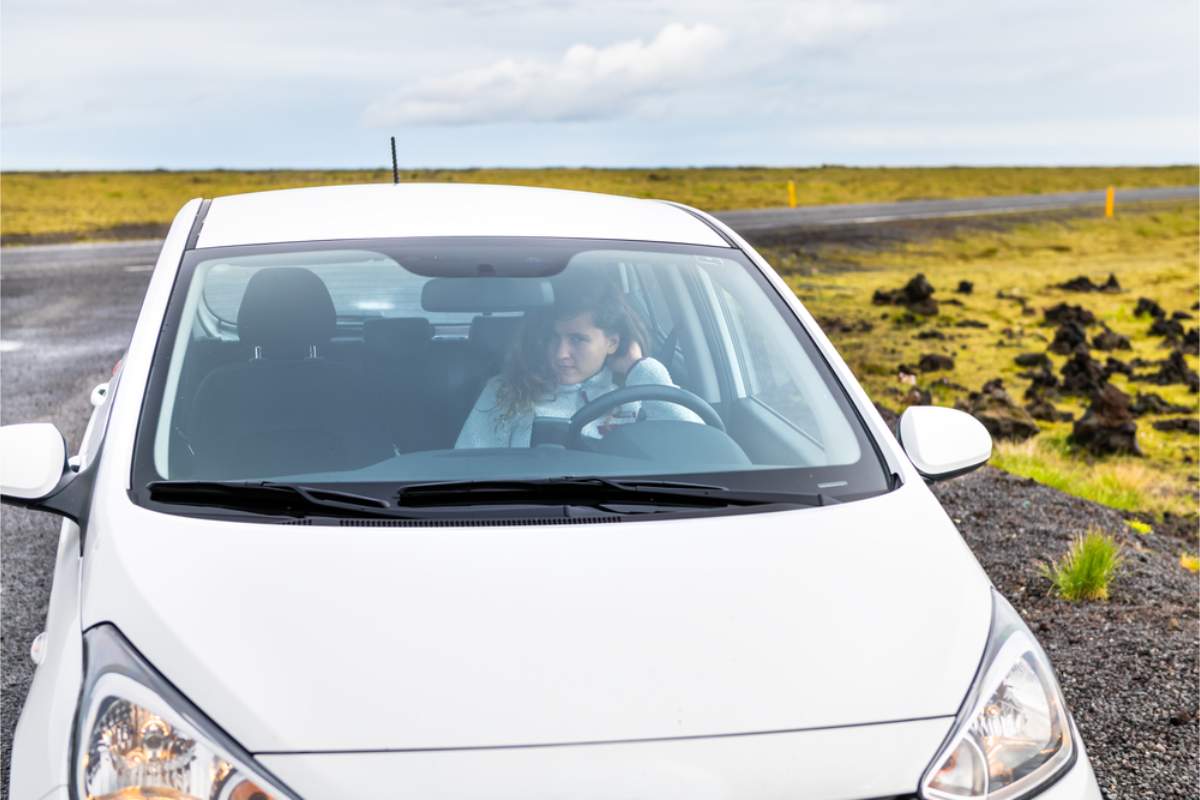 Compact 2WD vehicles for a road trip in Iceland Woman driving a compact 2WD car in Iceland