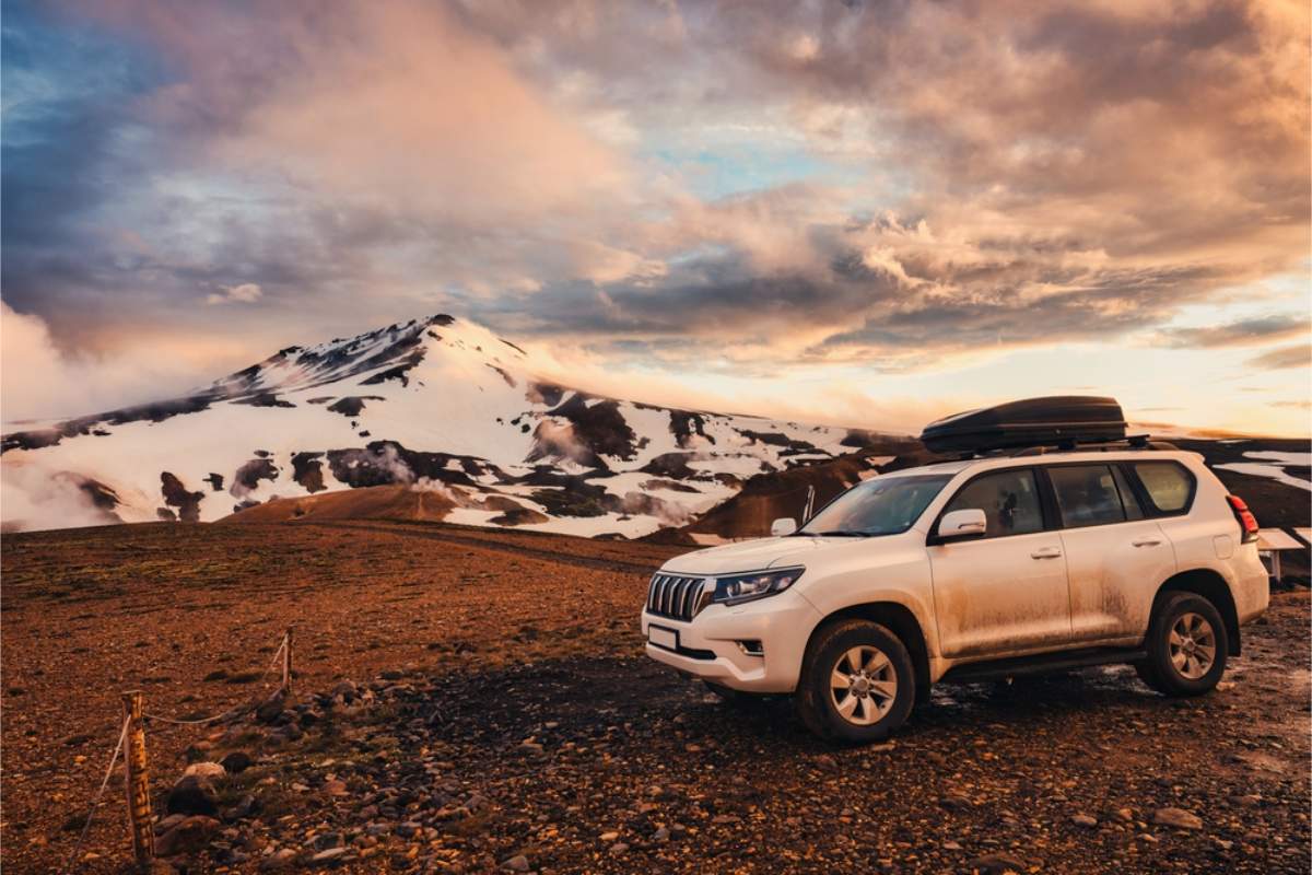 Top best 4x4 for a Highlands road trip in Iceland Sturdy 4x4 vehicle parked in a remote place of Iceland's highlands
