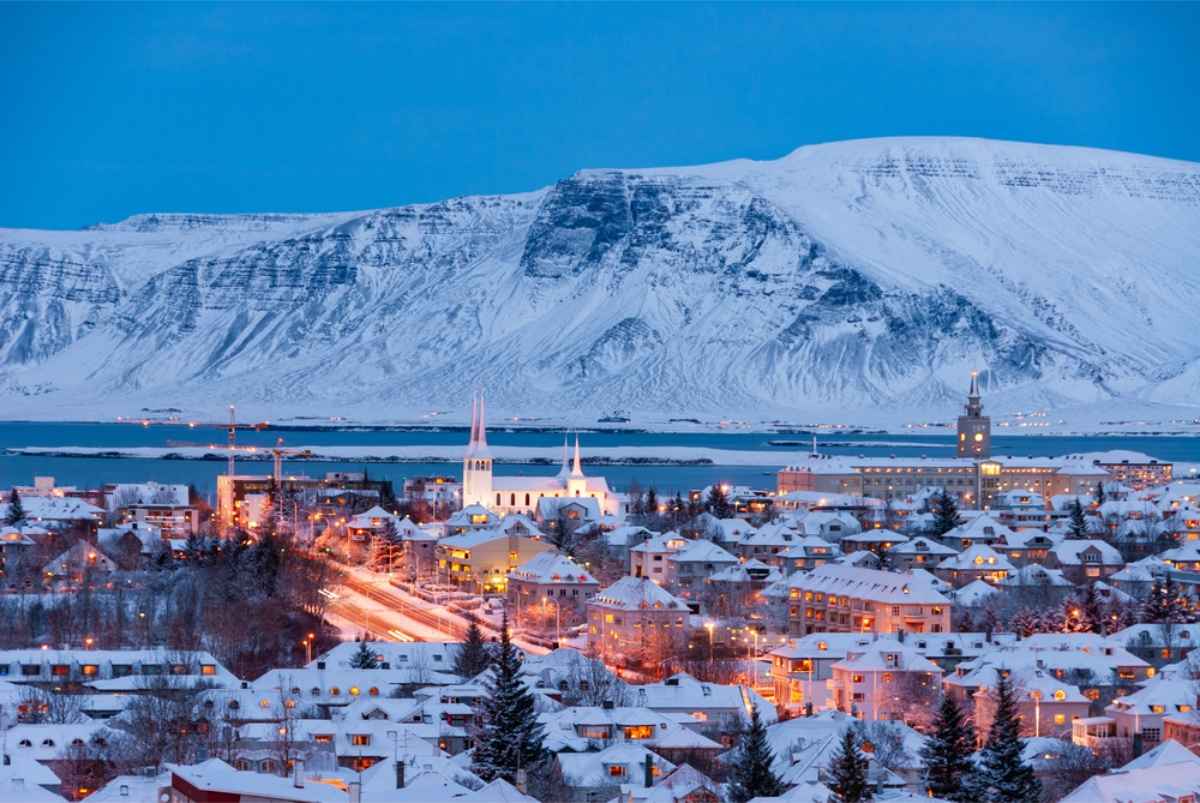 Reykjavik at dusk during the winter time completely covered in snow
