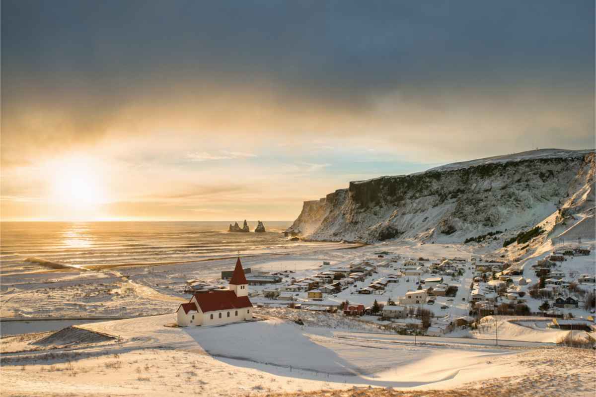 Town of Vik covered in snow at dusk