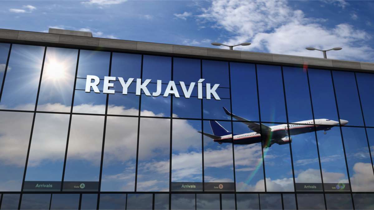 Reflection of an aircraft on Reykjavik airport terminal