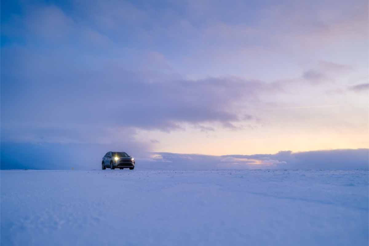 Iceland winter driving rules 4x4 vehicle with its headlights on during winter time