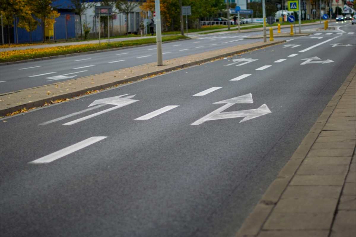 direction arrows painted on the road
