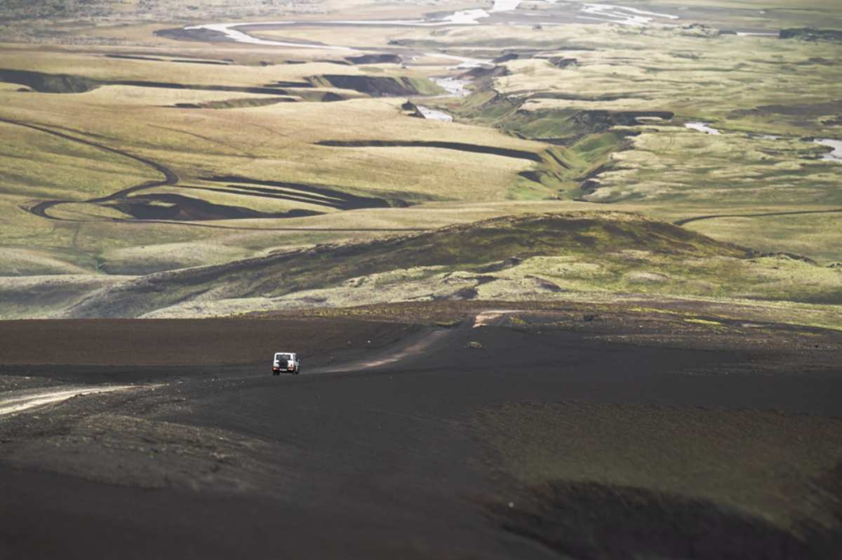 4x4 car rolling through the volcanic landscape of the Highlands
