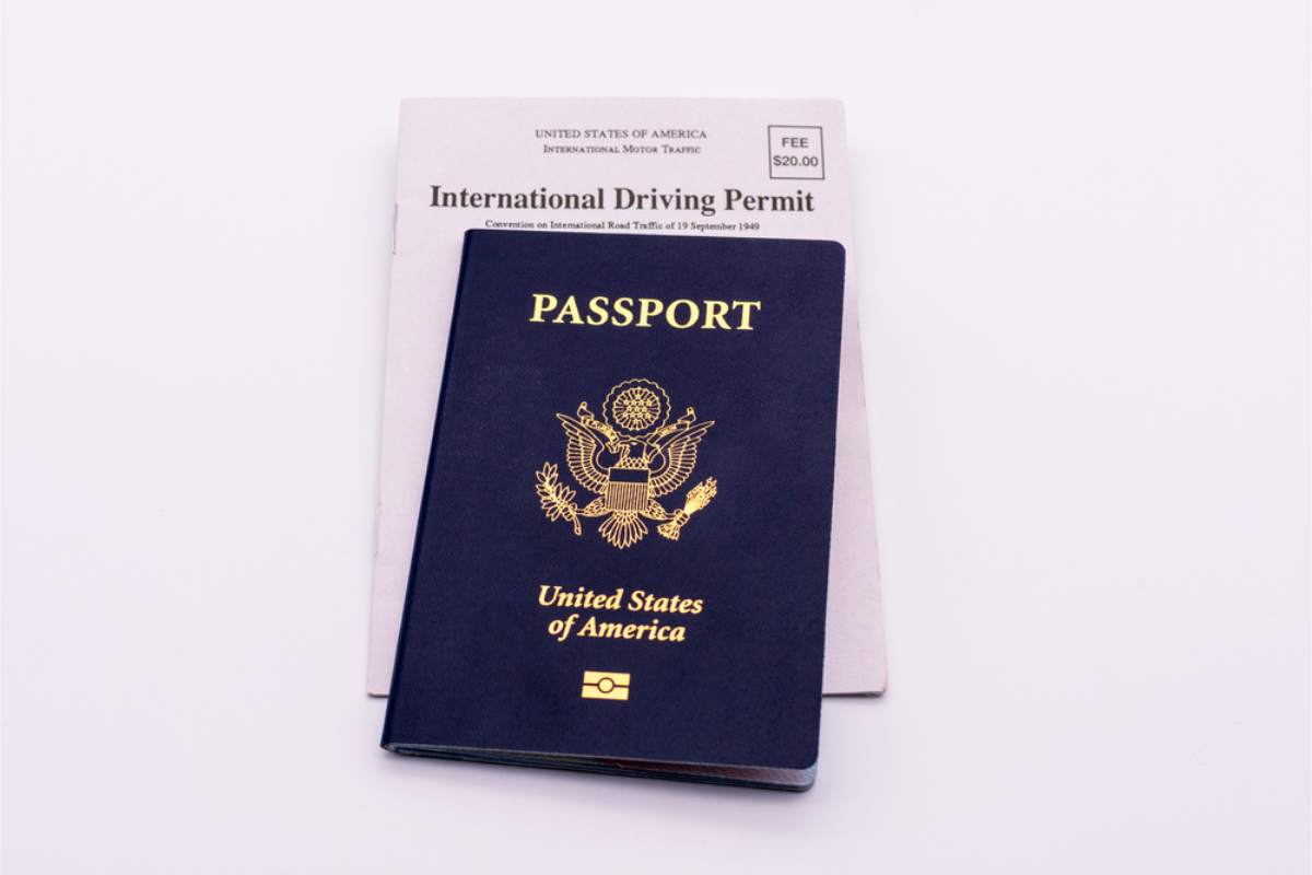 Passport placed on top of an international driving permit for renting a car in Iceland