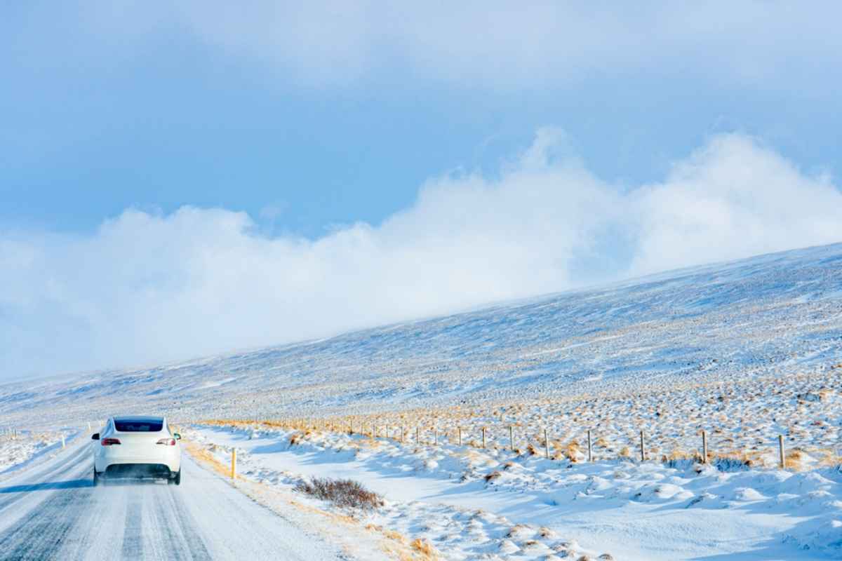 The importance of knowing winter conditions when driving a car in Iceland Car driving on a snowy road through winter conditions in Iceland