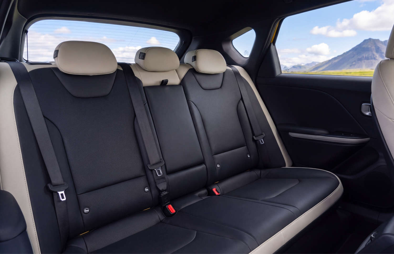 Bright yellow Kia XCeed automatic crossover with GPS, reverse camera, and heated seats, seats 5 with space for 2 luggage, ideal for Iceland trips.