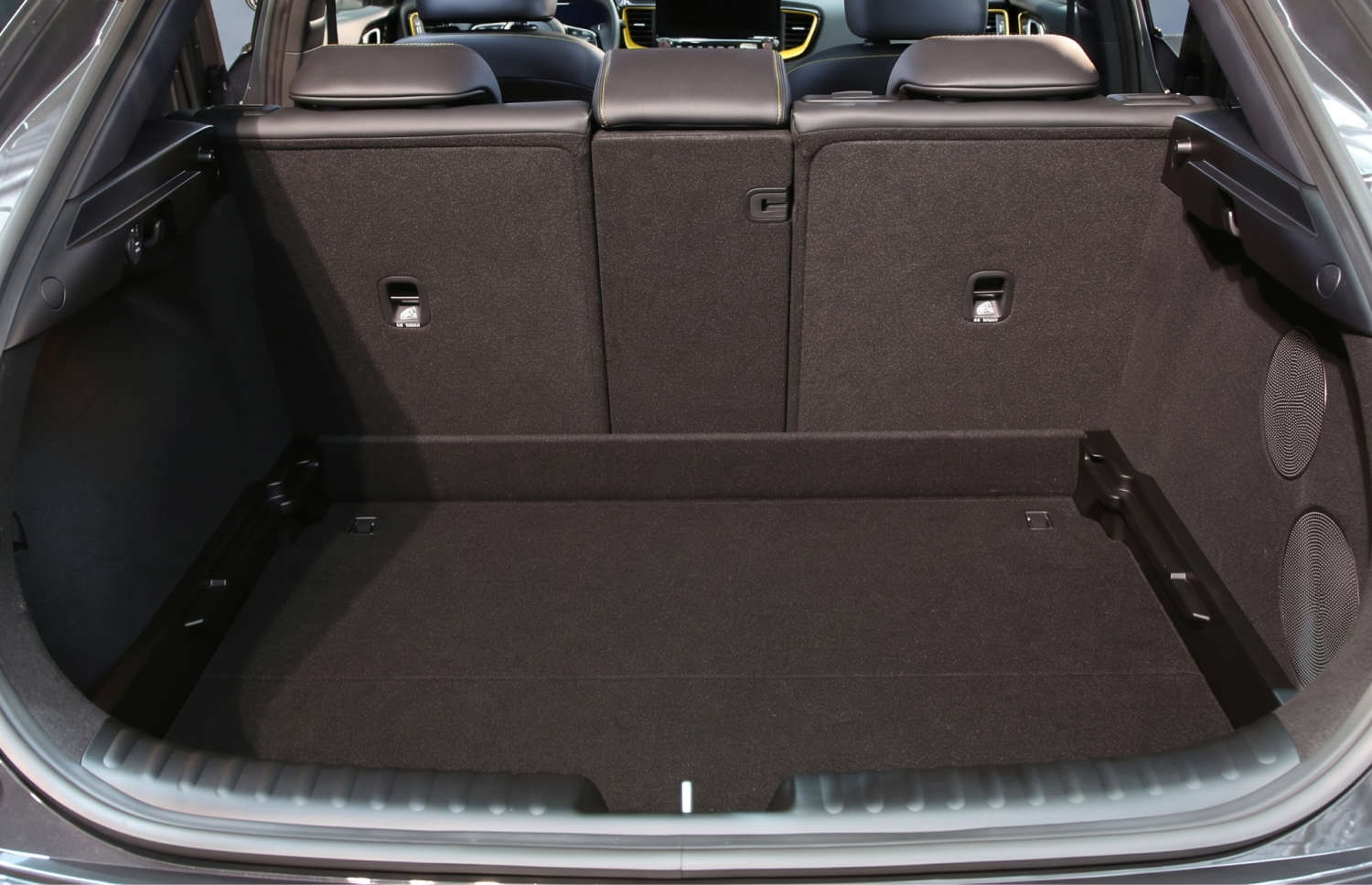 Bright yellow Kia XCeed automatic crossover with GPS, reverse camera, and heated seats, seats 5 with space for 2 luggage, ideal for Iceland trips.