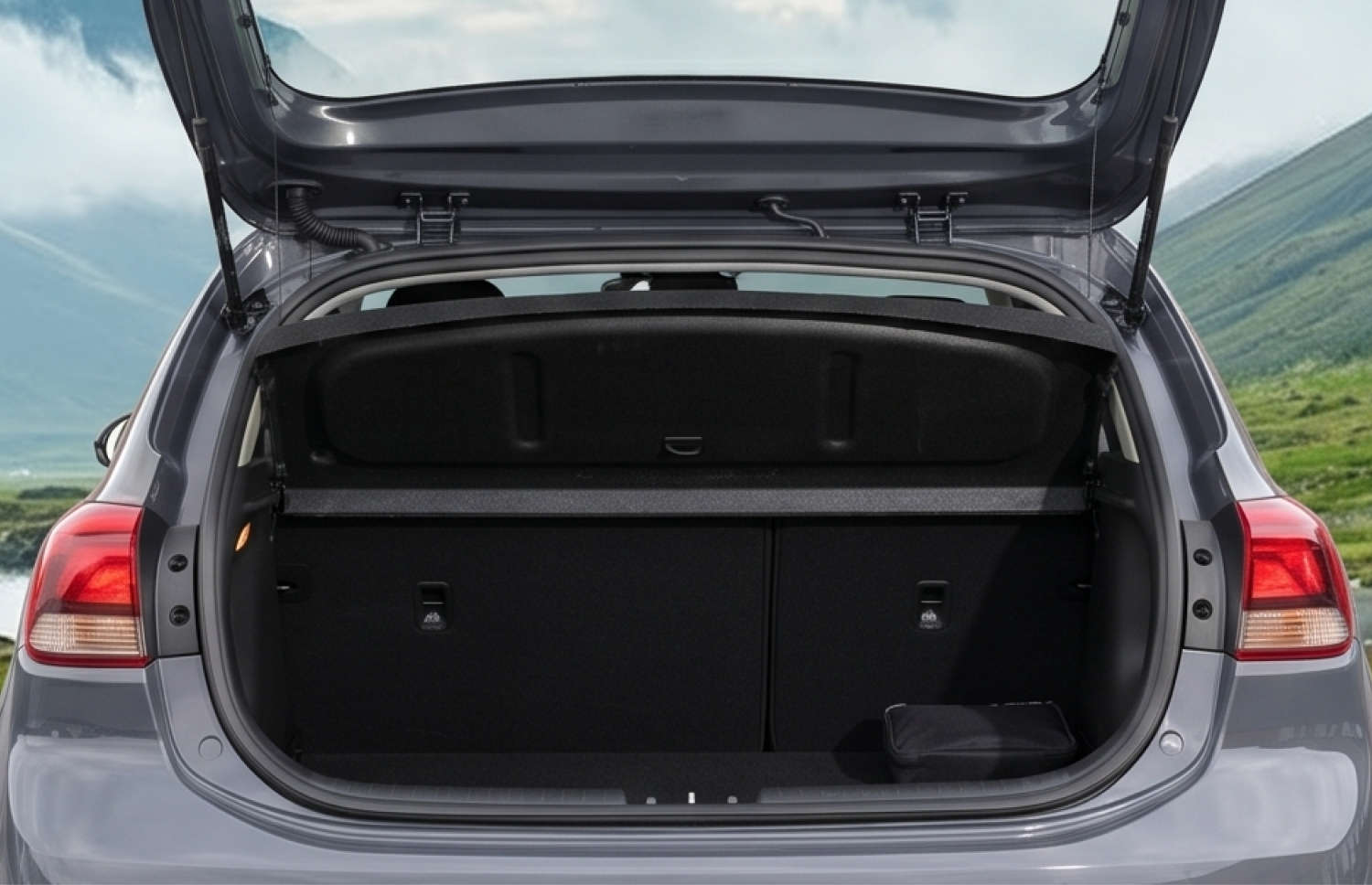 Blue Kia Rio with manual transmission, GPS, reverse camera, and space for 5 passengers and 2 luggage, ideal for Iceland road trips.