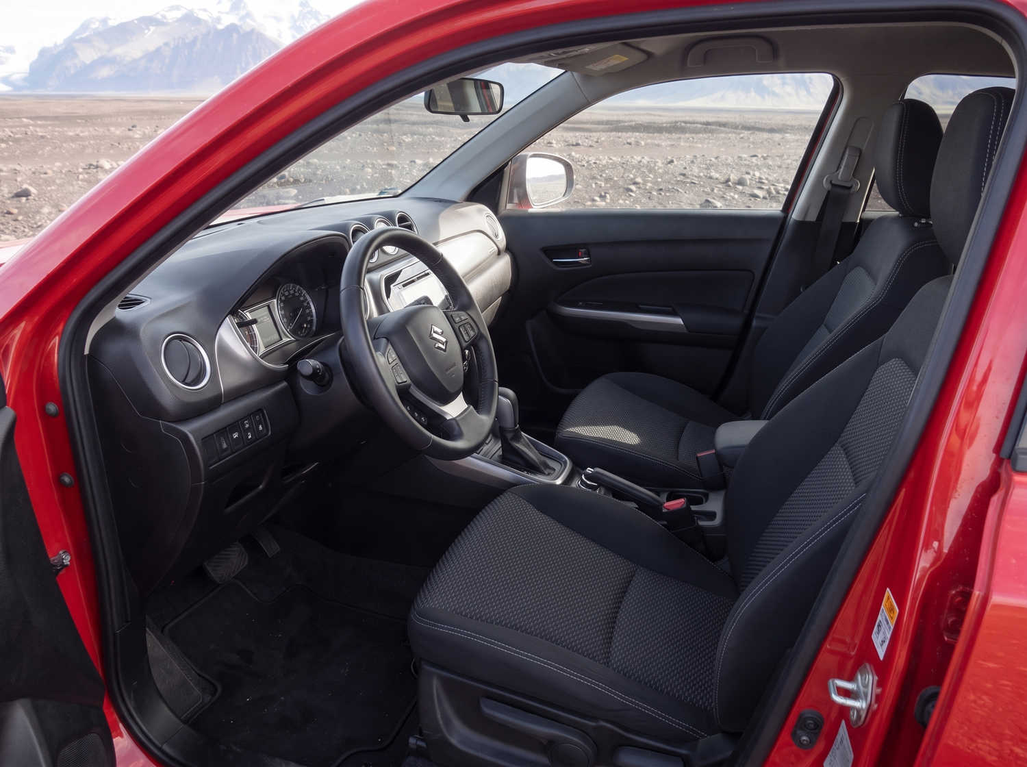 Suzuki Vitara. Ideal for navigating Iceland's highland roads and gravel protection, this rental car offers all the space for a smooth Icelandic road trip.