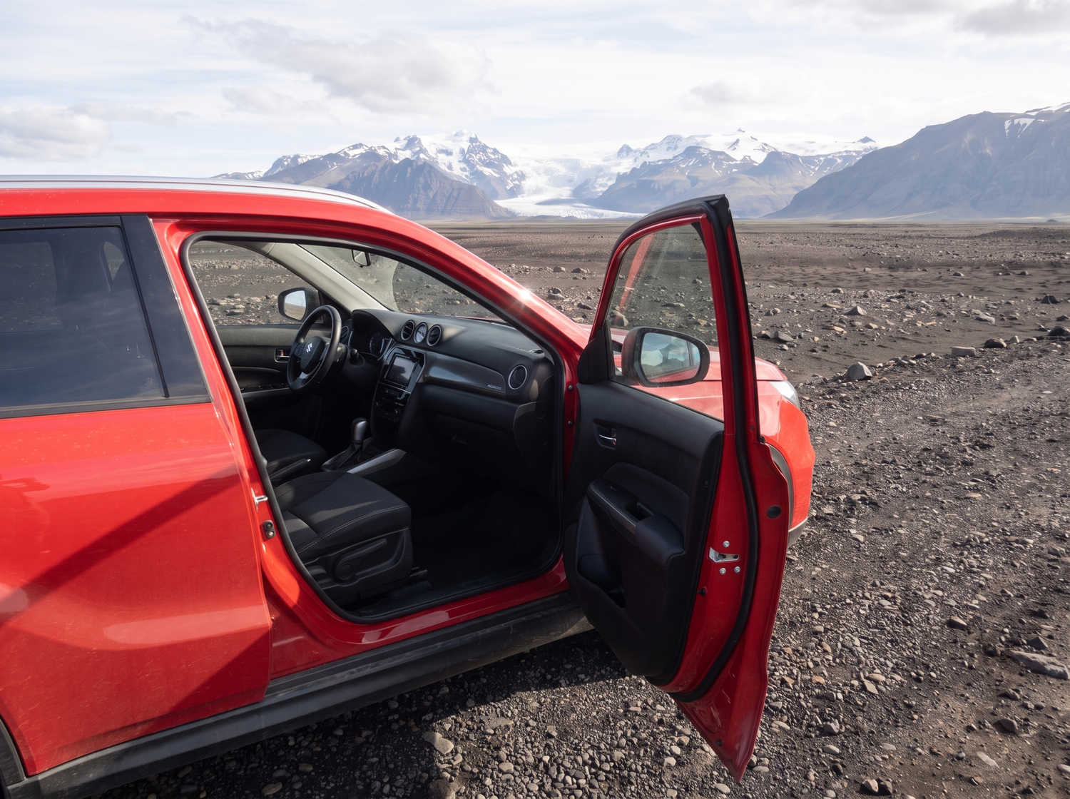 Suzuki Vitara. Ideal for navigating Iceland's highland roads and gravel protection, this rental car offers all the space for a smooth Icelandic road trip.