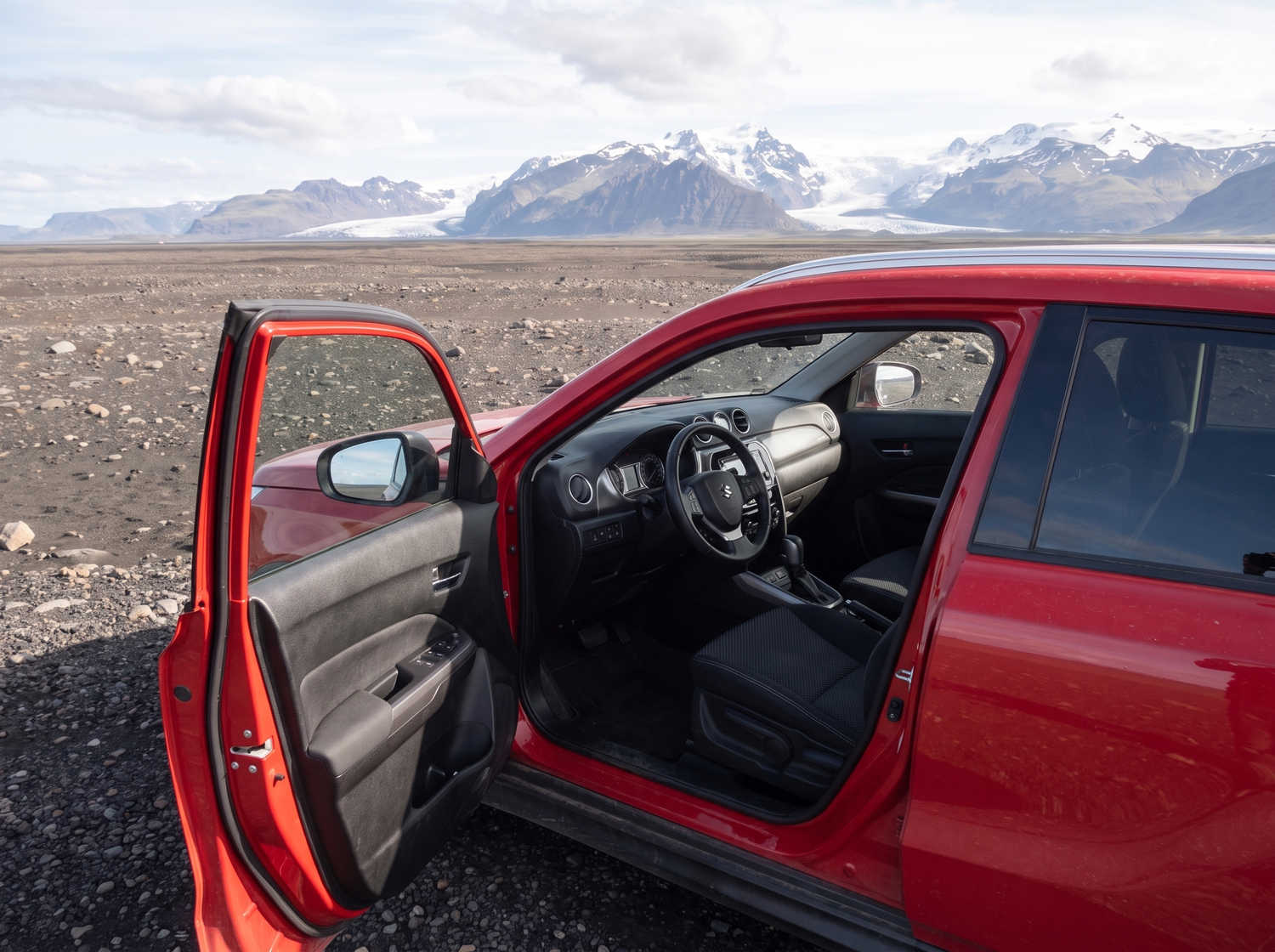 Suzuki Vitara. Ideal for navigating Iceland's highland roads and gravel protection, this rental car offers all the space for a smooth Icelandic road trip.