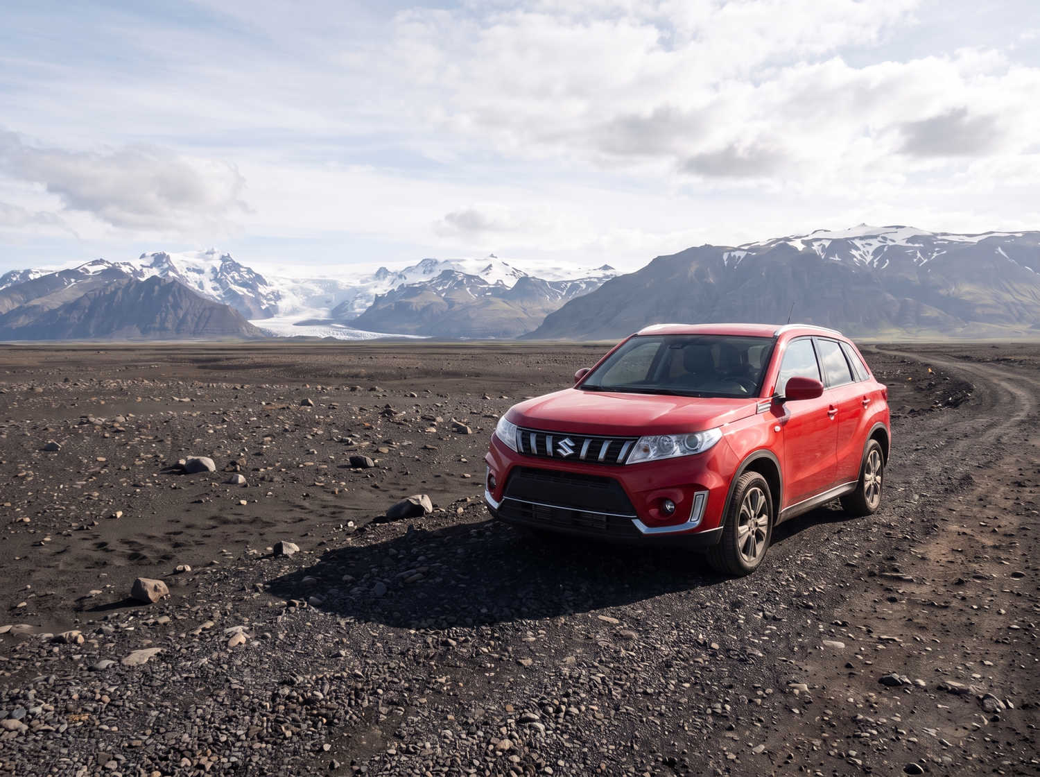 Suzuki Vitara. Ideal for navigating Iceland's highland roads and gravel protection, this rental car offers all the space for a smooth Icelandic road trip.
