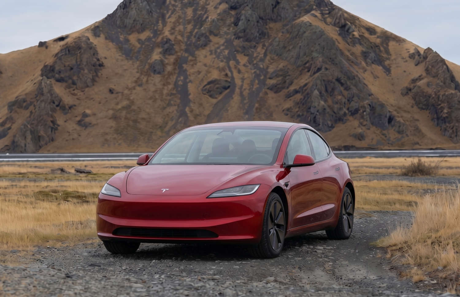 White Tesla Model 3 electric sedan with automatic transmission, GPS, reverse camera, heated seats, and space for 5 passengers in Iceland.
