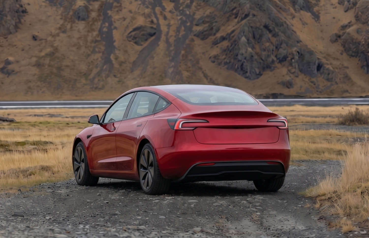 White Tesla Model 3 electric sedan with automatic transmission, GPS, reverse camera, heated seats, and space for 5 passengers in Iceland.