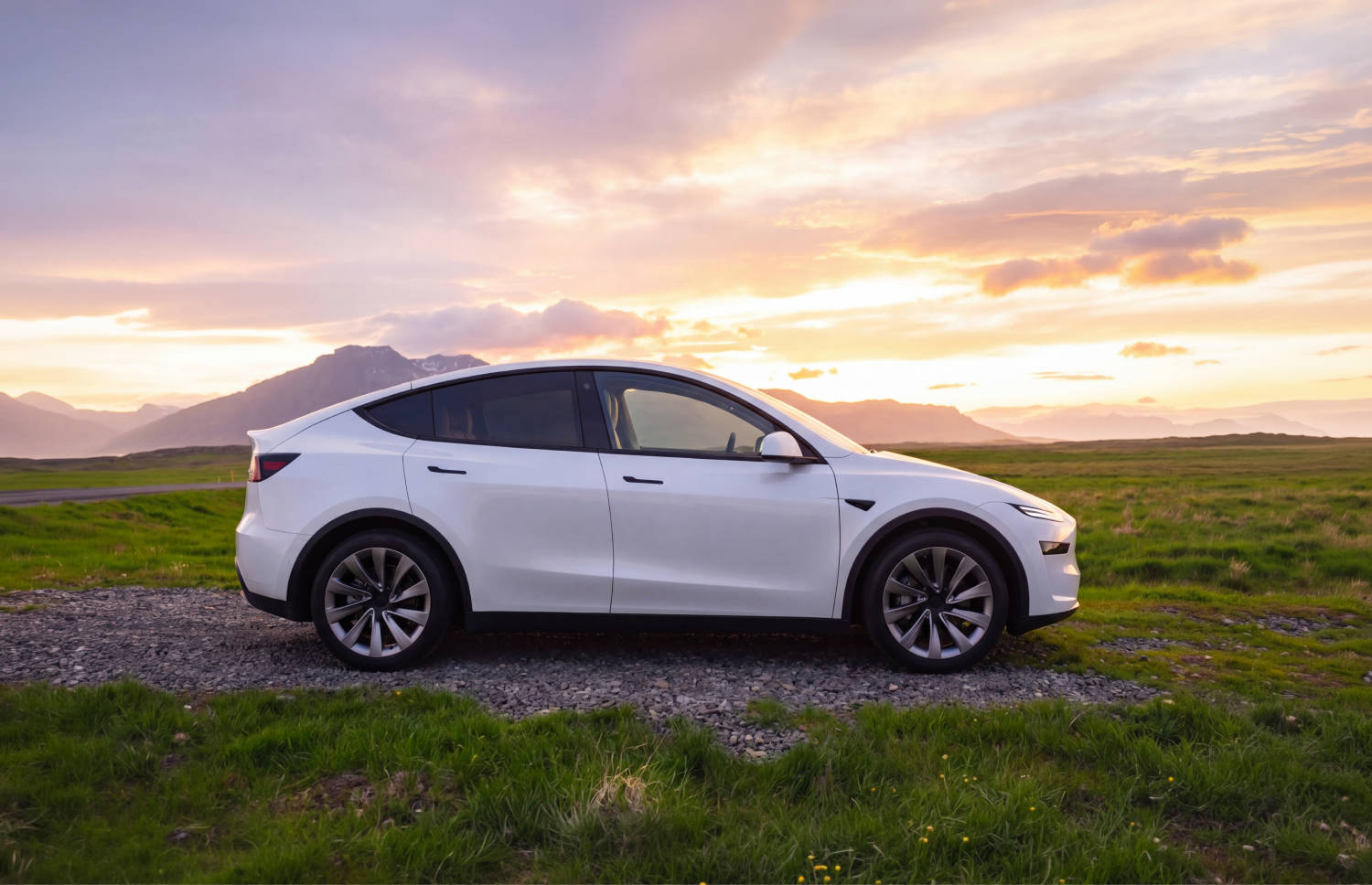 Blue Tesla Model Y electric SUV with automatic transmission, GPS, reverse camera, heated seats, and room for 5 passengers and 2 luggage in Iceland.