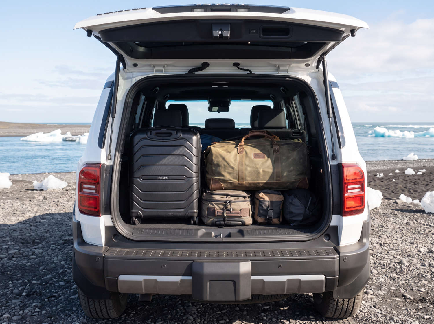 White Toyota Land Cruiser 250 4WD SUV with automatic transmission, 7 seats, USB charger, Bluetooth, and heated seats, perfect for Iceland off-road adventures.