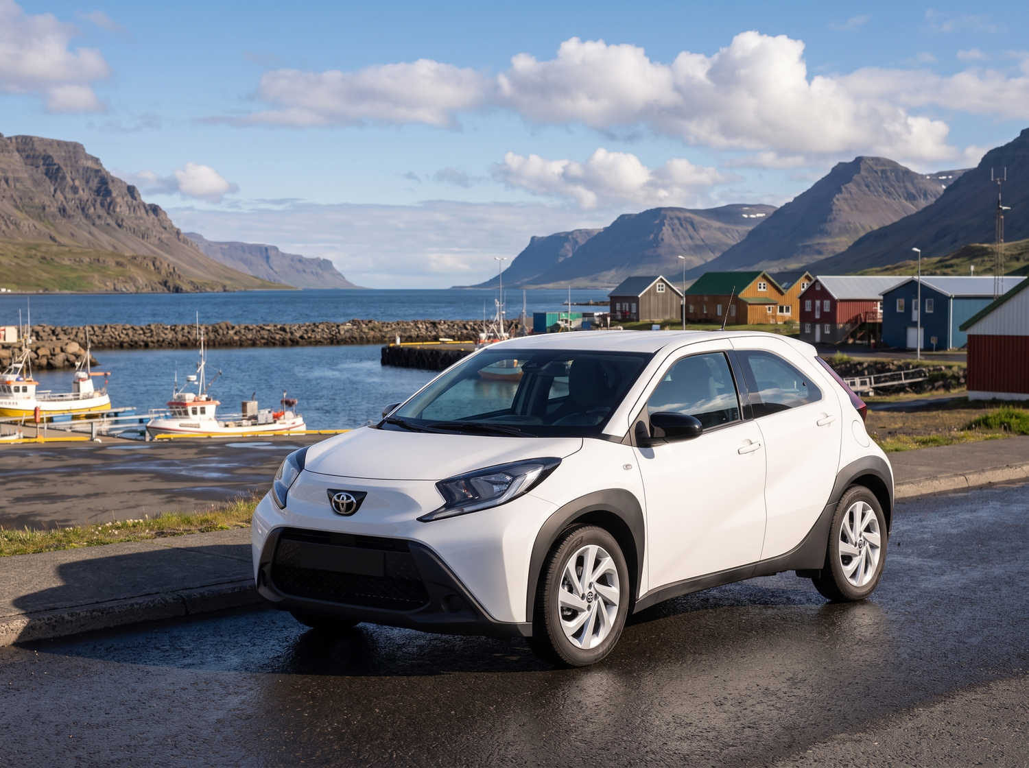 Compact Toyota Aygo in metallic grey with manual transmission, perfect for 4 passengers, ideal for city driving in Iceland.