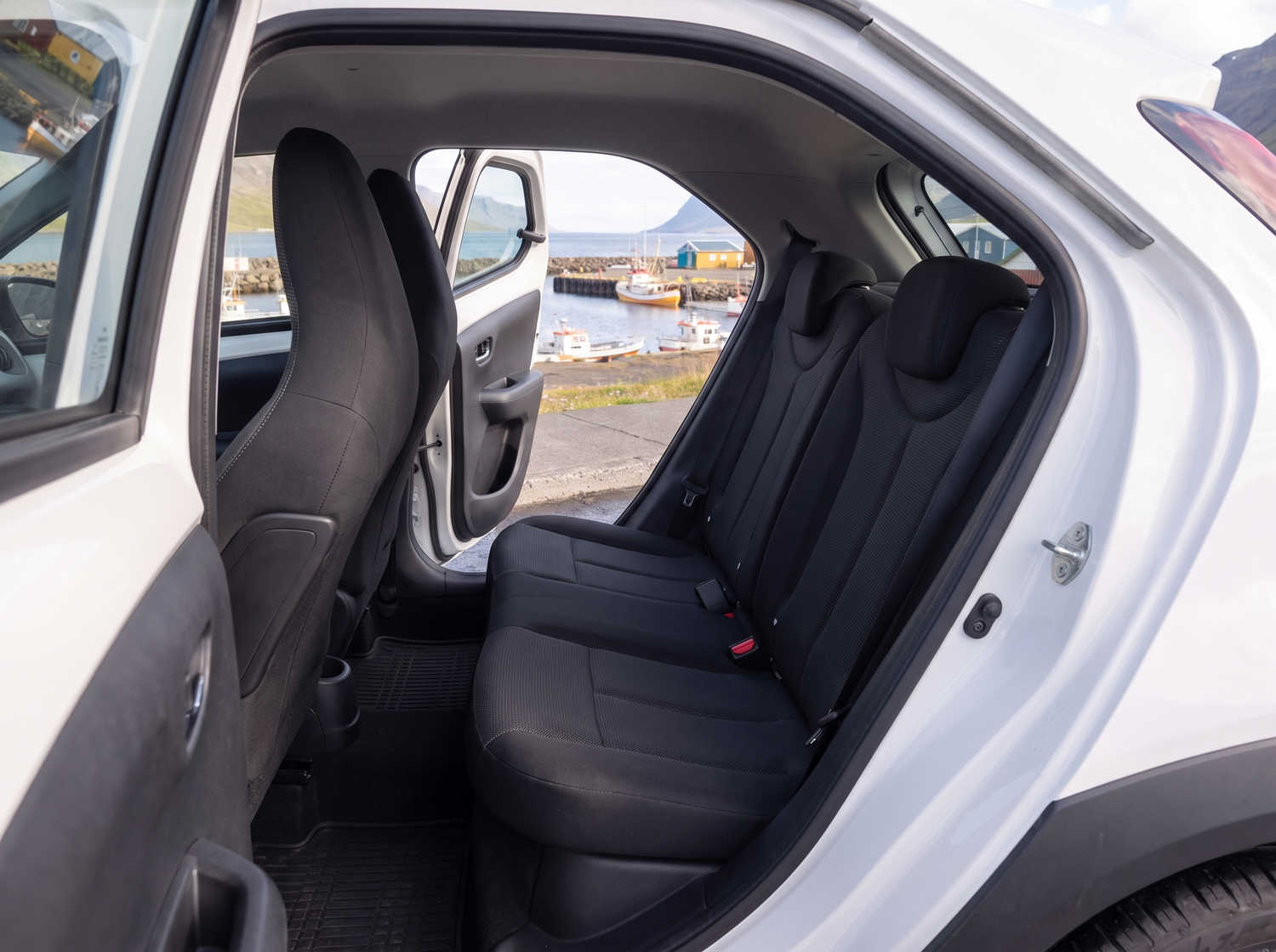 Compact Toyota Aygo in metallic grey with manual transmission, perfect for 4 passengers, ideal for city driving in Iceland.