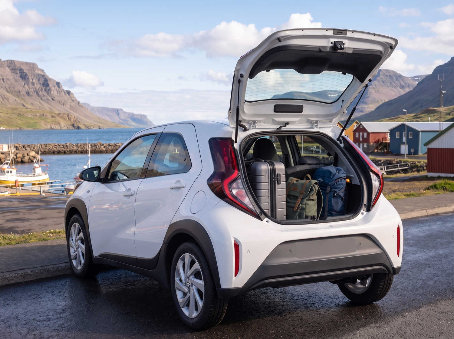 Compact Toyota Aygo in metallic grey with manual transmission, perfect for 4 passengers, ideal for city driving in Iceland.